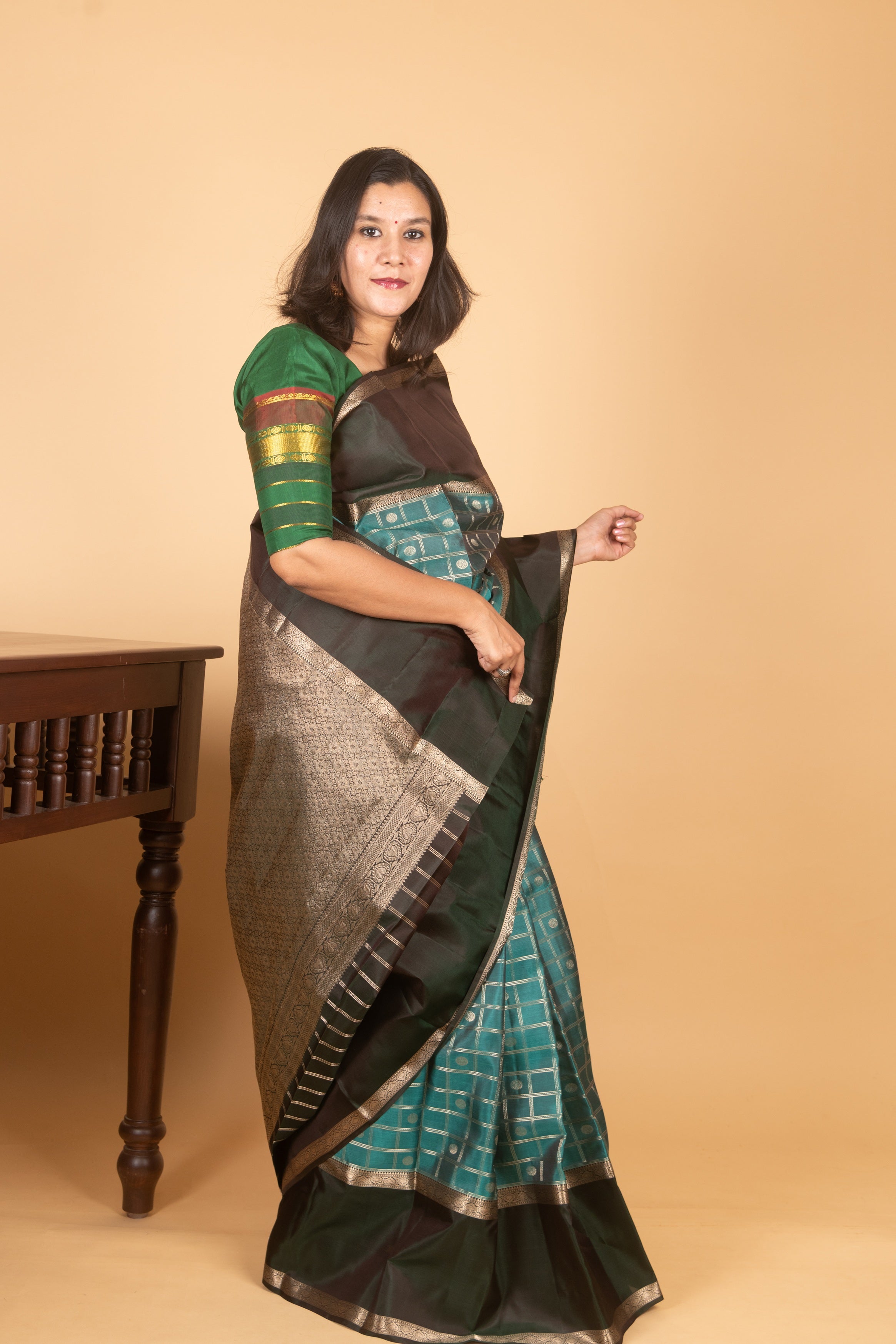 Teal Kanjivaram with Retta Pettu Border