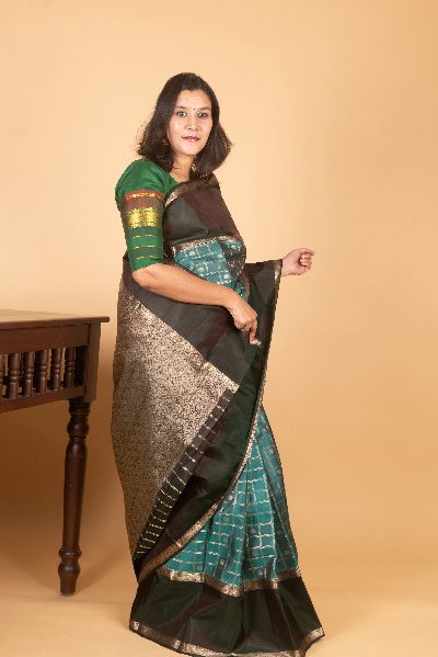 Teal Kanjivaram with Retta Pettu Border